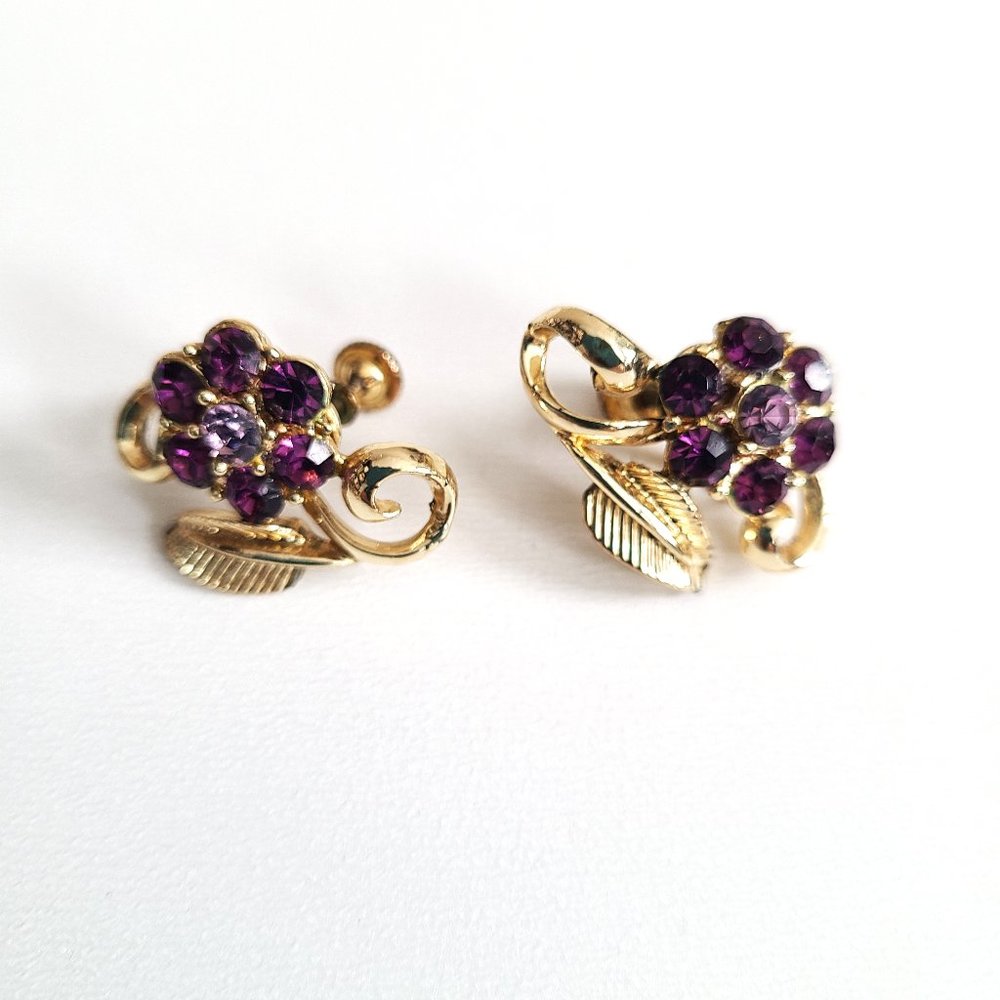 Vintage large screw back purple rhinestone gold tone earrings with floral design